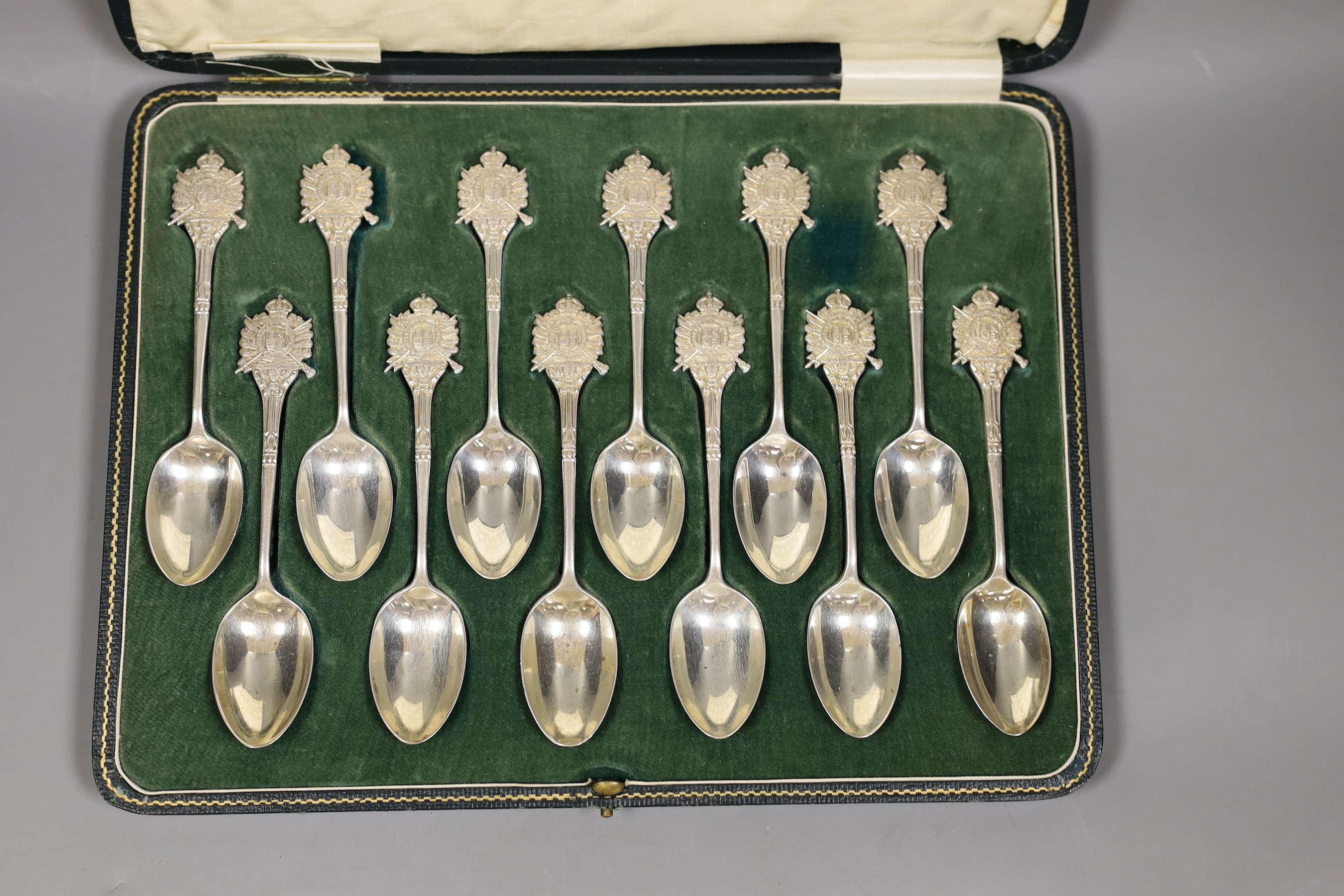 Rifle trophies: a cased set of twelve spoons, two cased sets of silver spoons and a cased set of six plated spoons